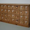 Antiker deutscher Apothekerschrank aus Kiefernholz mit Emailleschilden, 1900er