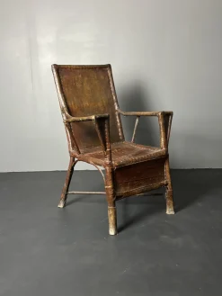 Art Deco Wabi Sabi Colonial Armlehnstuhl aus Rattan & Kunstleder, 1920er