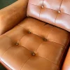 Vintage Vinyl Leder Lounge Drehsessel & Fußhocker in Cognac Braun, 1970er, 2er Set